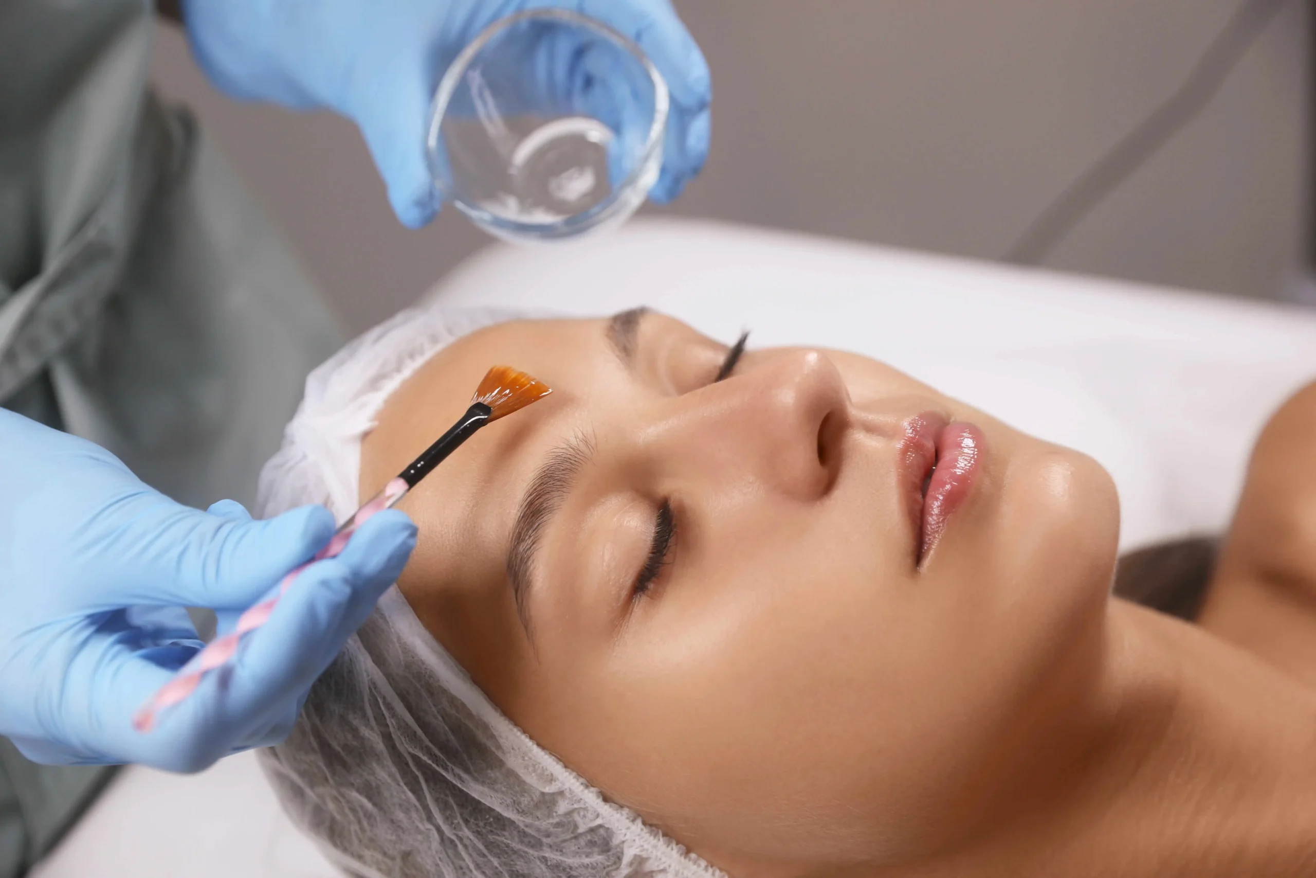 a woman getting a face mask treatment